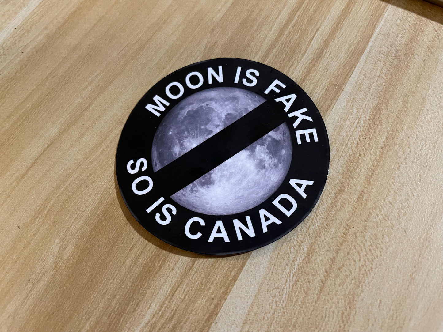 MOON IS FAKE sticker