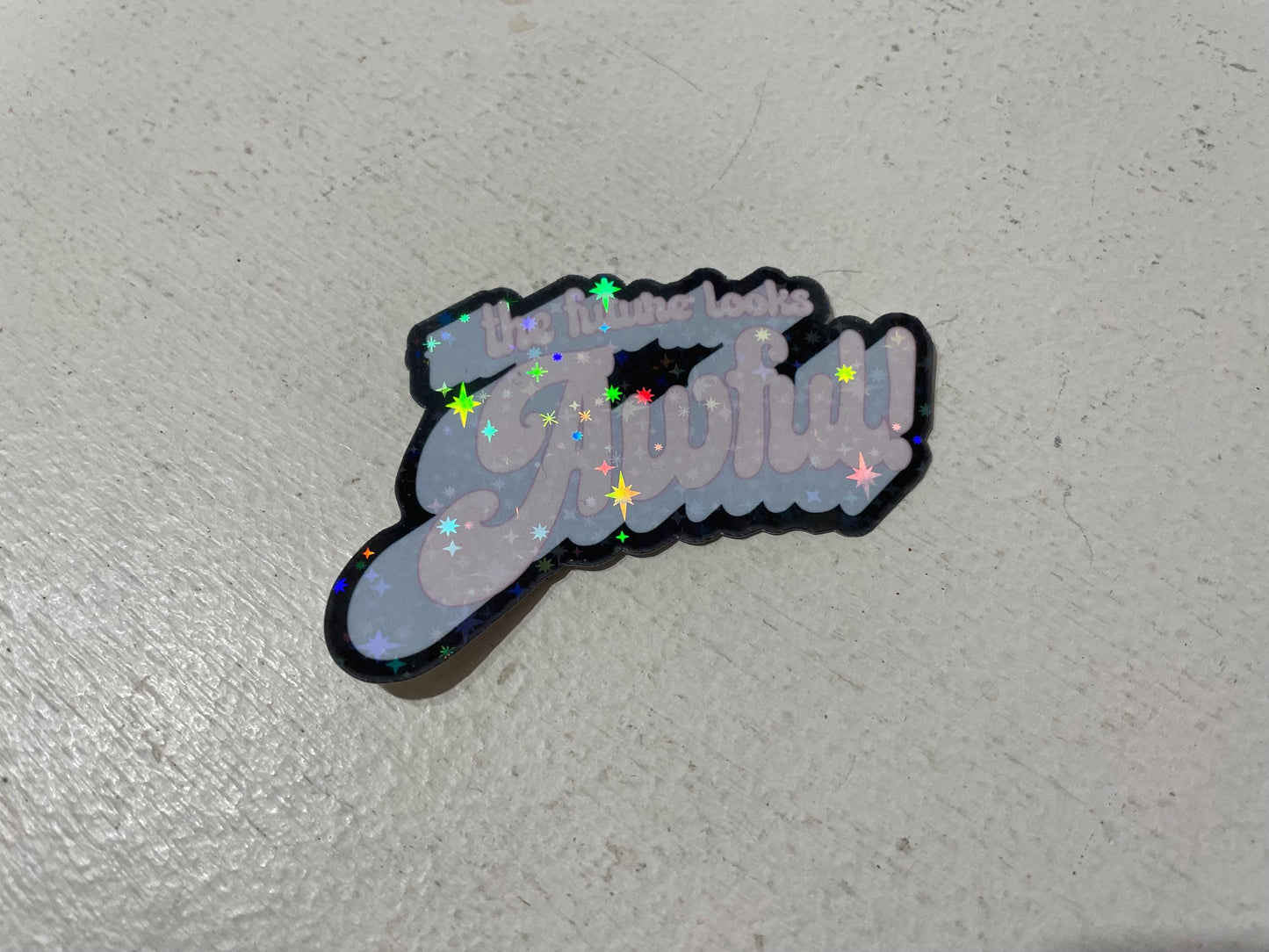 The Future Looks Awful holographic sticker